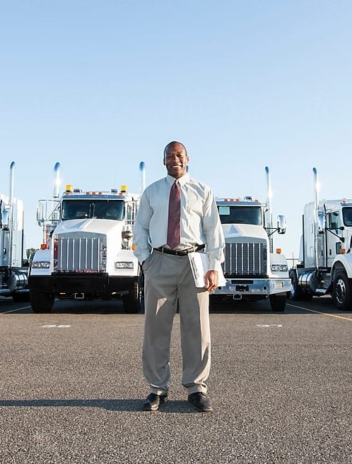 Man standing in front of truck