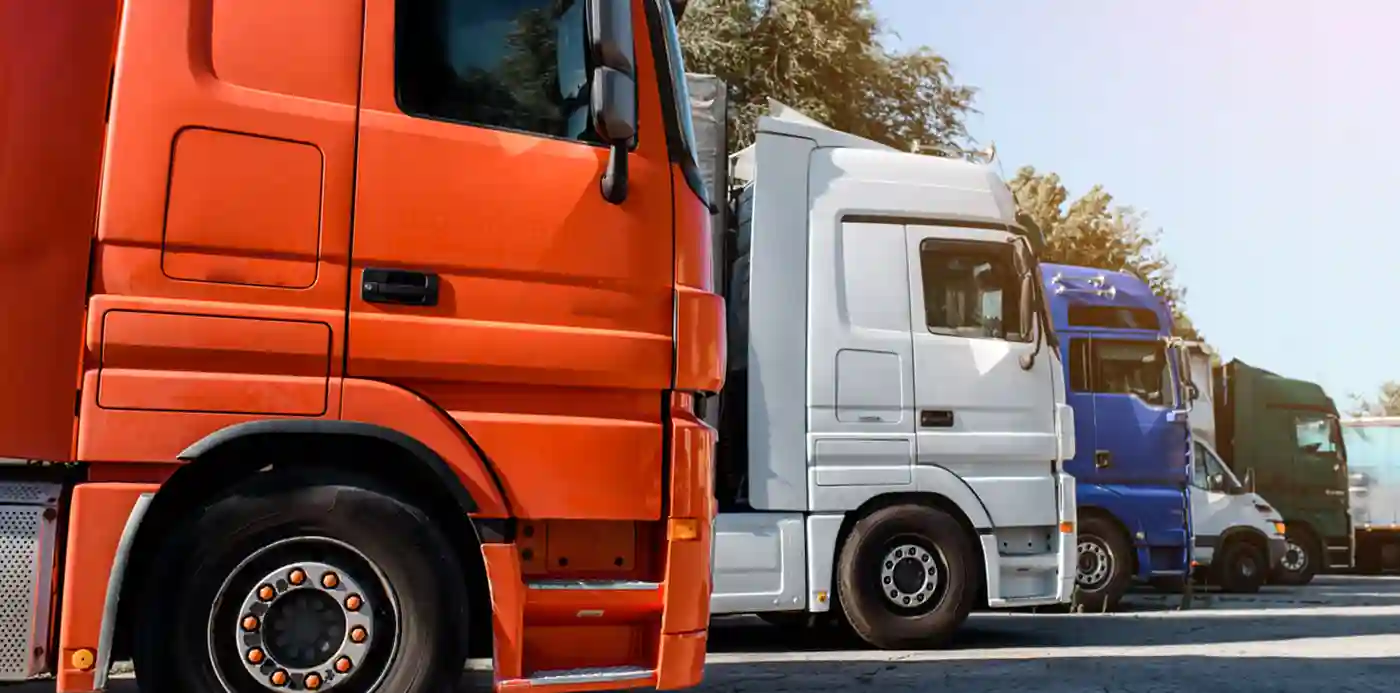 A fleet of large semi cabs lined up