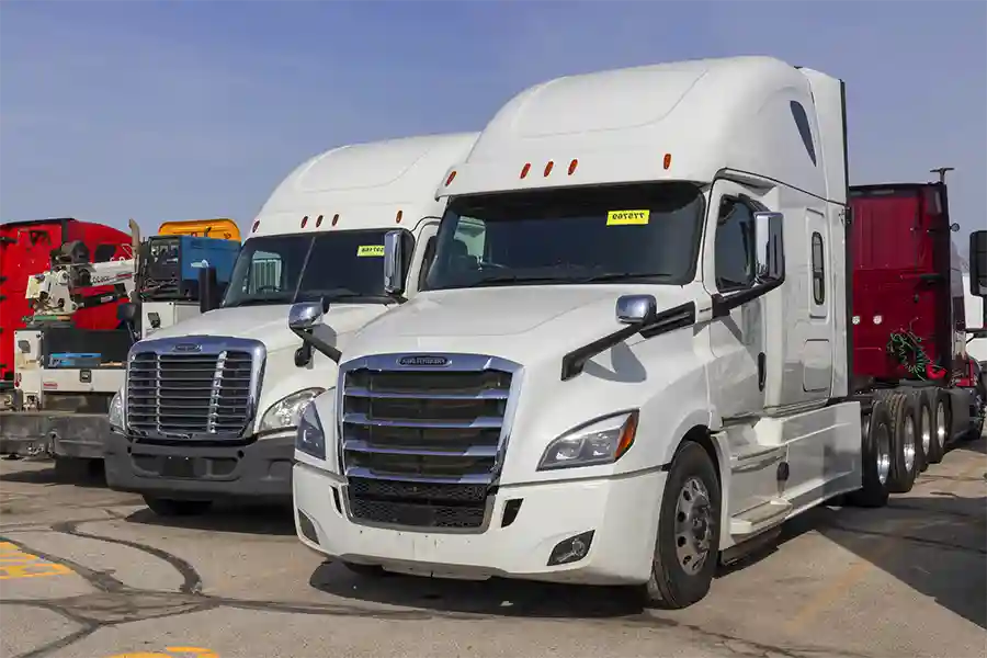 A group of parked semi trucks