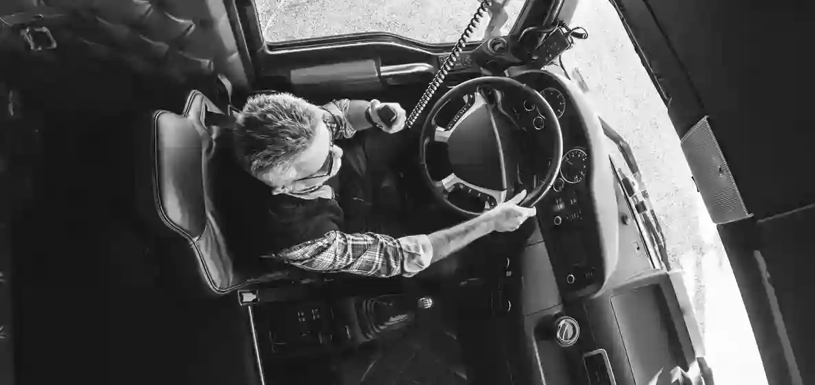 A top down photo of a man driving a truck